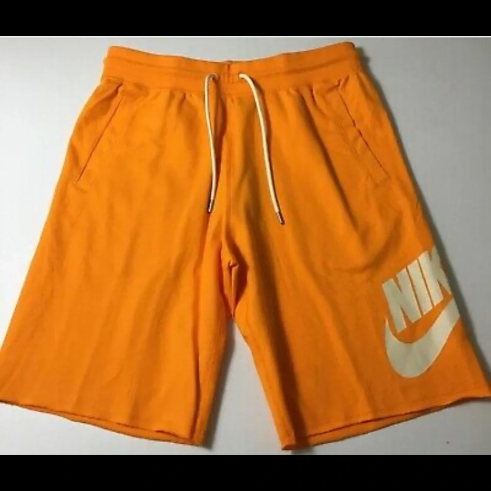 Nike Orange Men's Athletic Shorts with White Logo